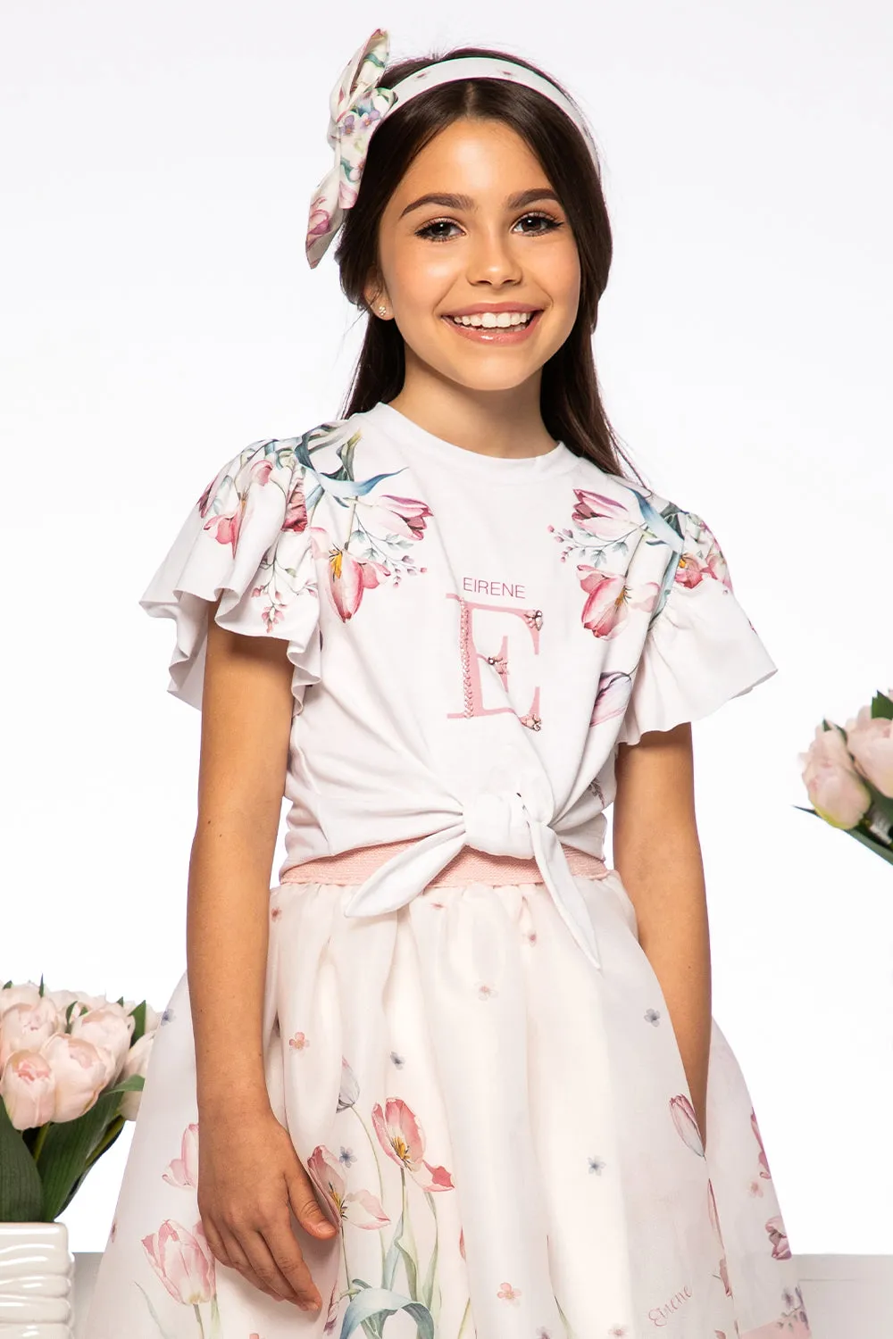 White tulip print t-shirt with hand-embellished logo and bow
